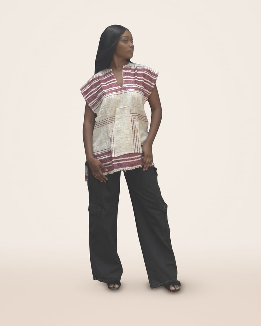 Berry Qowa top, Cream with bands of maroon and pink stripes at the shoulders and hem, plus a big front pocket, worn by a model