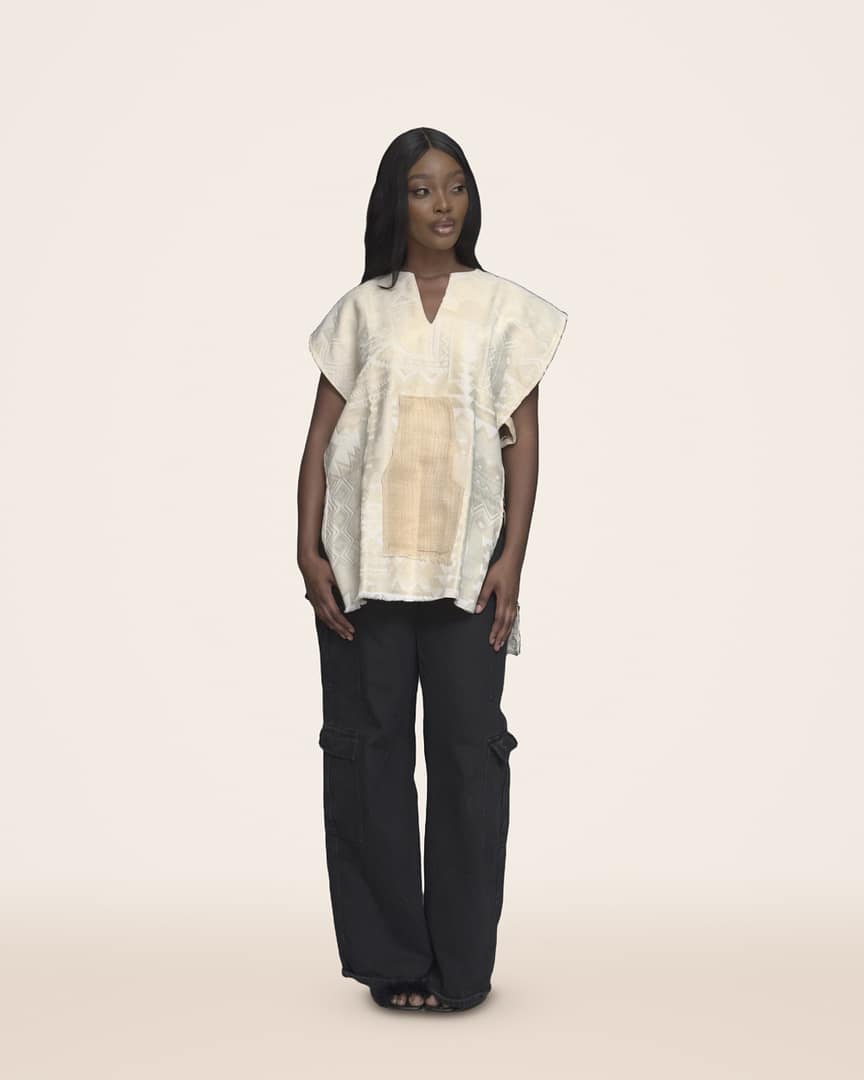 Coconut Qowa top, Plain cream tweed with a lighter panel down the front, made to go with everything, worn by a model